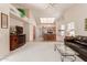 Open concept living room, kitchen, and breakfast bar at 19511 N 143Rd Dr, Sun City West, AZ 85375