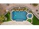 Aerial view of a luxurious pool and spa with surrounding landscaping at 2499 S Pinyon Village Dr # 25, Gold Canyon, AZ 85118