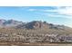 Aerial view of community nestled in the mountains at 26686 W Piute Ave, Buckeye, AZ 85396