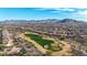 Aerial view of community with golf course and mountain views at 26686 W Piute Ave, Buckeye, AZ 85396