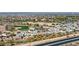 Aerial community view, golf course, and highway at 26686 W Piute Ave, Buckeye, AZ 85396