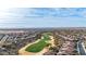 Aerial view of community with golf course and mountain views at 26686 W Piute Ave, Buckeye, AZ 85396