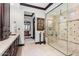 Luxurious bathroom with a large shower and double vanity at 26686 W Piute Ave, Buckeye, AZ 85396