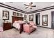 Main bedroom with king bed, sitting area, and large windows at 26686 W Piute Ave, Buckeye, AZ 85396
