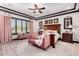 Elegant main bedroom with a king-size bed and sitting area at 26686 W Piute Ave, Buckeye, AZ 85396
