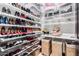 Large walk-in closet with ample shelving for shoes and clothing at 26686 W Piute Ave, Buckeye, AZ 85396