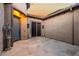 Private courtyard with stone tile flooring and a gray door at 26686 W Piute Ave, Buckeye, AZ 85396