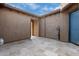 Private courtyard with tile flooring, and access to interior and exterior at 26686 W Piute Ave, Buckeye, AZ 85396