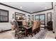 Elegant dining room with large table and leather chairs at 26686 W Piute Ave, Buckeye, AZ 85396