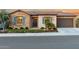 Lovely curb appeal with stone facade and landscaped yard at 26686 W Piute Ave, Buckeye, AZ 85396