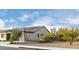 Home's exterior showcasing a modern design and solar panels at 26686 W Piute Ave, Buckeye, AZ 85396