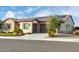 Single-story home with solar panels, two-car garage, and desert landscaping at 26686 W Piute Ave, Buckeye, AZ 85396