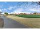 Golf course path with manicured greens and desert landscape at 26686 W Piute Ave, Buckeye, AZ 85396