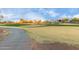 Golf course with sand traps and paved pathway at 26686 W Piute Ave, Buckeye, AZ 85396