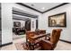 Spacious home office with a large desk and view into living area at 26686 W Piute Ave, Buckeye, AZ 85396