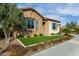 Two-car garage and front entrance with stone accents at 26686 W Piute Ave, Buckeye, AZ 85396