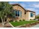 Two-car garage and front entrance with stone accents at 26686 W Piute Ave, Buckeye, AZ 85396