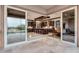 Modern kitchen with dark cabinetry and access to the pool area at 26686 W Piute Ave, Buckeye, AZ 85396