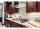 Modern kitchen features gas cooktop and ample counter space at 26686 W Piute Ave, Buckeye, AZ 85396