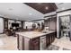 Open concept kitchen with island and wine storage at 26686 W Piute Ave, Buckeye, AZ 85396