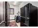 Laundry room with washer, dryer, and additional refrigerator at 26686 W Piute Ave, Buckeye, AZ 85396