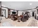 Spacious living room featuring leather furniture and decorative accents at 26686 W Piute Ave, Buckeye, AZ 85396