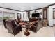 Elegant living room with comfortable seating and a large TV at 26686 W Piute Ave, Buckeye, AZ 85396