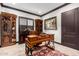 Home office with built-in shelving and a large desk at 26686 W Piute Ave, Buckeye, AZ 85396