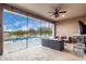 Covered patio with wicker furniture, overlooking the pool and golf course at 26686 W Piute Ave, Buckeye, AZ 85396