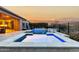 Luxury pool and spa with a fire pit and stunning sunset views at 26686 W Piute Ave, Buckeye, AZ 85396
