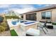 Resort-style pool, spa, and fire pit in backyard at 26686 W Piute Ave, Buckeye, AZ 85396