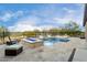 Luxury pool and spa with fire pit and golf course views at 26686 W Piute Ave, Buckeye, AZ 85396