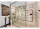 Large walk-in shower with glass enclosure and tile accents at 26686 W Piute Ave, Buckeye, AZ 85396
