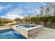 Relaxing spa adjacent to the pool at 26686 W Piute Ave, Buckeye, AZ 85396