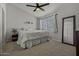 King-size bed in bright bedroom with ceiling fan at 2955 N Oregon St # 9, Chandler, AZ 85225