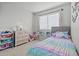 Well-lit bedroom with a twin bed and dresser at 2955 N Oregon St # 9, Chandler, AZ 85225