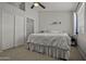 King-size bed in bright bedroom with ceiling fan at 2955 N Oregon St # 9, Chandler, AZ 85225