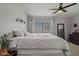 King-size bed in bright bedroom with ceiling fan at 2955 N Oregon St # 9, Chandler, AZ 85225