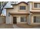 Two-story stucco townhouse with a Spanish-style tile roof and a private entrance at 2955 N Oregon St # 9, Chandler, AZ 85225