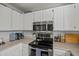 Clean kitchen with stainless steel appliances and white cabinets at 2955 N Oregon St # 9, Chandler, AZ 85225