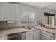Kitchen boasts stainless steel appliances and white cabinets at 2955 N Oregon St # 9, Chandler, AZ 85225