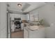 Modern kitchen featuring stainless steel appliances and white cabinetry at 2955 N Oregon St # 9, Chandler, AZ 85225
