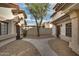 Shared courtyard with walkways and landscaping between townhouses at 2955 N Oregon St # 9, Chandler, AZ 85225