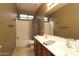 Clean bathroom with dual sinks and a shower at 3337 W Galvin St, Phoenix, AZ 85086