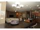 Bright dining room with a large dark wood table and chandelier at 3337 W Galvin St, Phoenix, AZ 85086