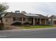 Exterior view of a cozy single-Gathering house with solar panels and a well-maintained lawn at 3341 W Windrose Dr, Phoenix, AZ 85029