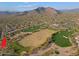 Expansive aerial view featuring a golf course, desert landscaping, and stunning mountain backdrop at 33809 N 67Th St, Scottsdale, AZ 85266