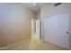 Cozy bedroom with carpet, light walls, standard closet, and an entrance to the hall at 33809 N 67Th St, Scottsdale, AZ 85266