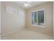 Bedroom with a ceiling fan and natural light streaming through the shuttered windows at 33809 N 67Th St, Scottsdale, AZ 85266