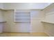 Walk-in closet with built-in shelving and rods, offering plenty of storage space at 33809 N 67Th St, Scottsdale, AZ 85266